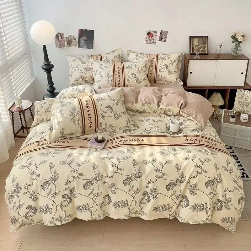 Cream-colored decorbites cotton printed bedding set with botanical print and brown trim featuring happiness text