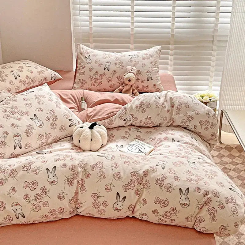 Pastel pink and cream cotton flower printed comforter set featuring bunny and rose pattern decorbites cotton flower bedding