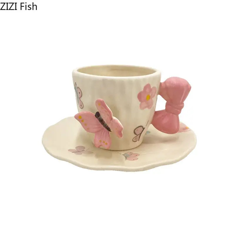 Cream-colored ceramic cup with pink butterfly and bowknot handle floral decals in decorbites bowknot ceramic saucer set