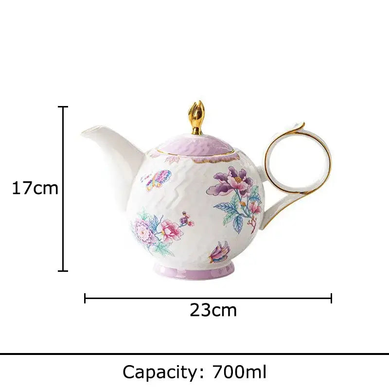 A delicate white porcelain coffee mug set with floral and butterfly patterns in pastel hues and gold trim