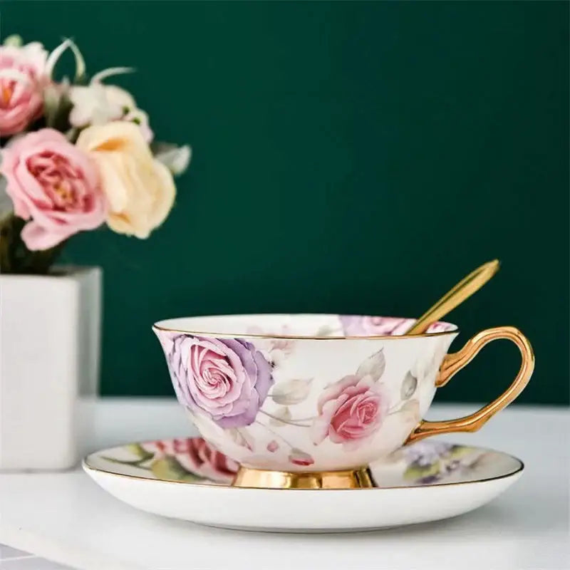 Floral pink and purple porcelain tea cup set with hand-painted roses and gold trim for elegant dining room use