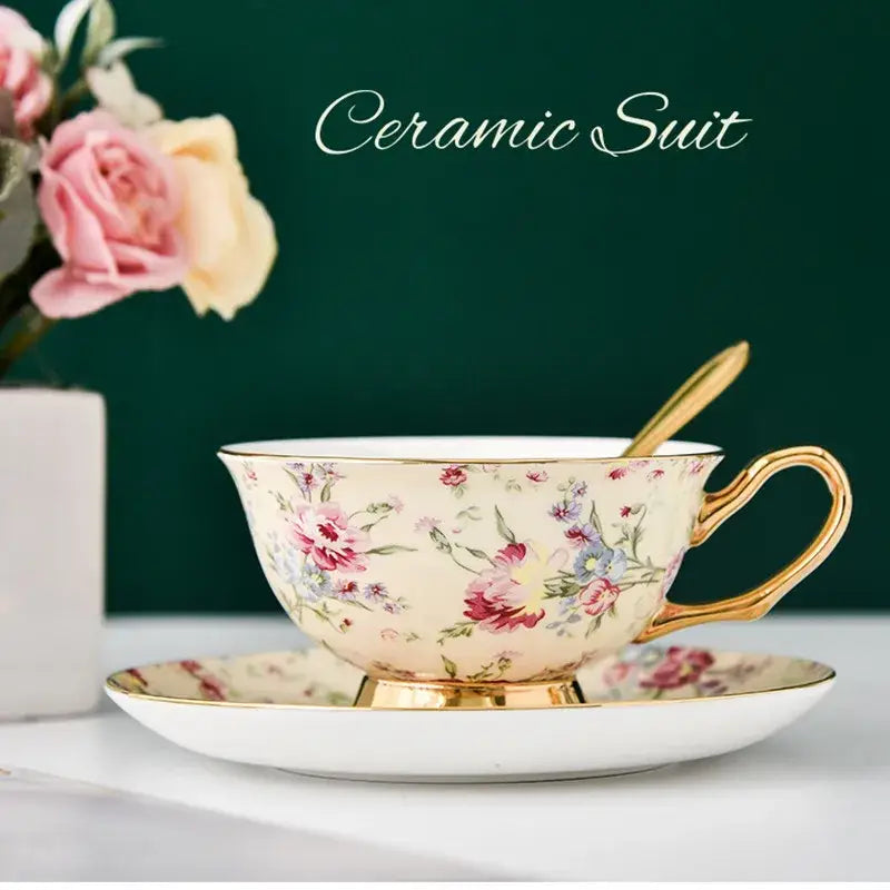 Elegant cream-colored porcelain tea cup set with pink and purple floral patterns and gold trim for dining room use