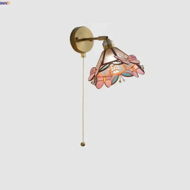 Delicate pink and teal decorbites butterfly glass wall light with floral motifs and brass finish for bedroom decor