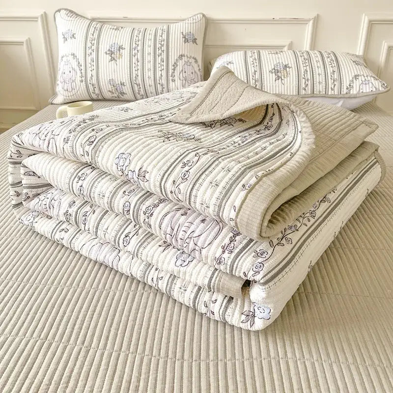 A soft cream-colored quilt with gray floral striped pattern and vertical ribbing for decorbites cartoon small bed sheets