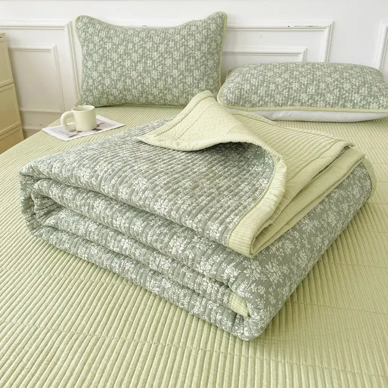 A soft sage green quilt with delicate white floral pattern and ribbed texture for decorbites cartoon small fresh bed sheets