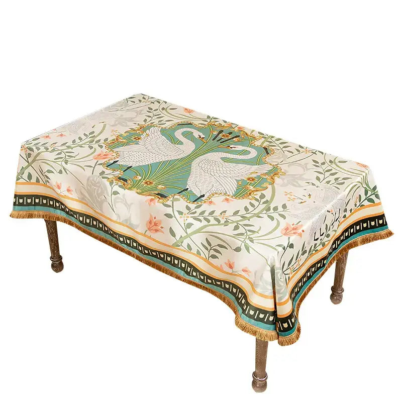 Elegant cream floral print velvet tablecloth with swans green foliage gold accents and tassels for dining room decor