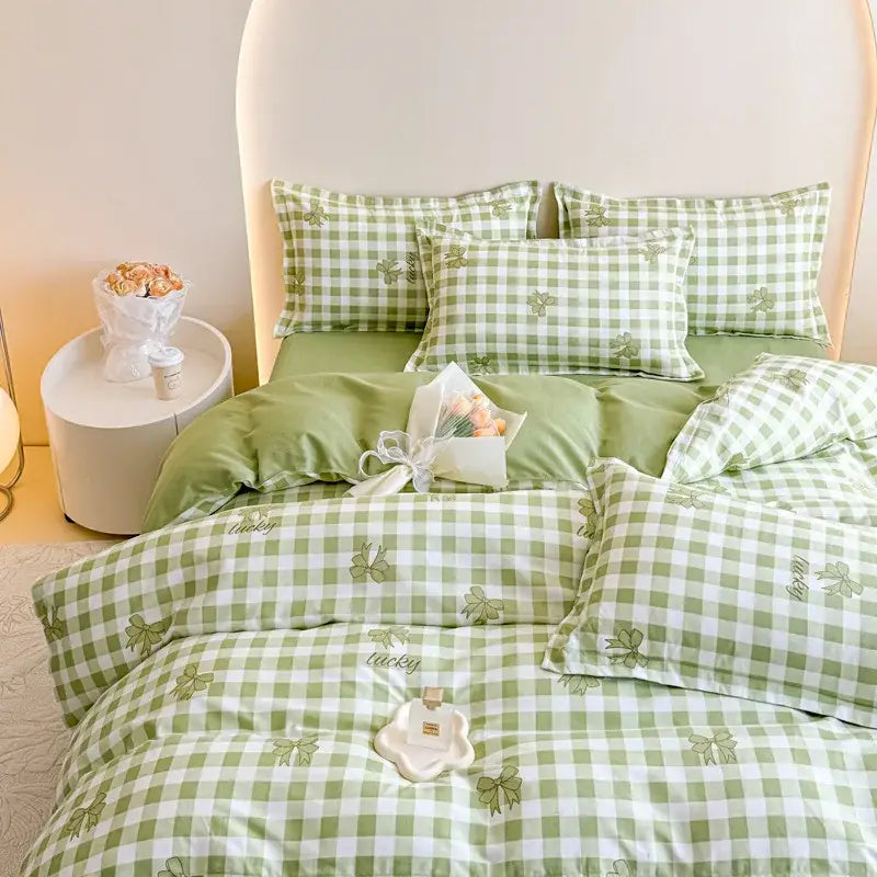 Green and white checkered cotton printed bedding set with embroidered clover motifs from decorbites for bedroom use