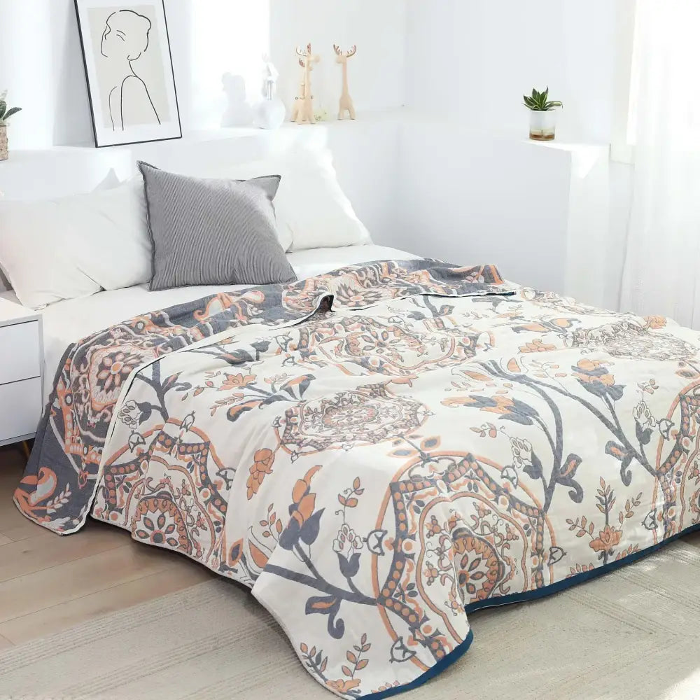Cream cotton gauze summer blanket with quilted floral terracotta navy blue and muted gold botanical pattern