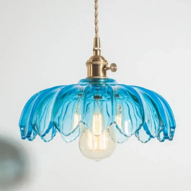 A delicate blue glass pendant lamp with petal design and decorbites brass glass led hardware for bedroom decor