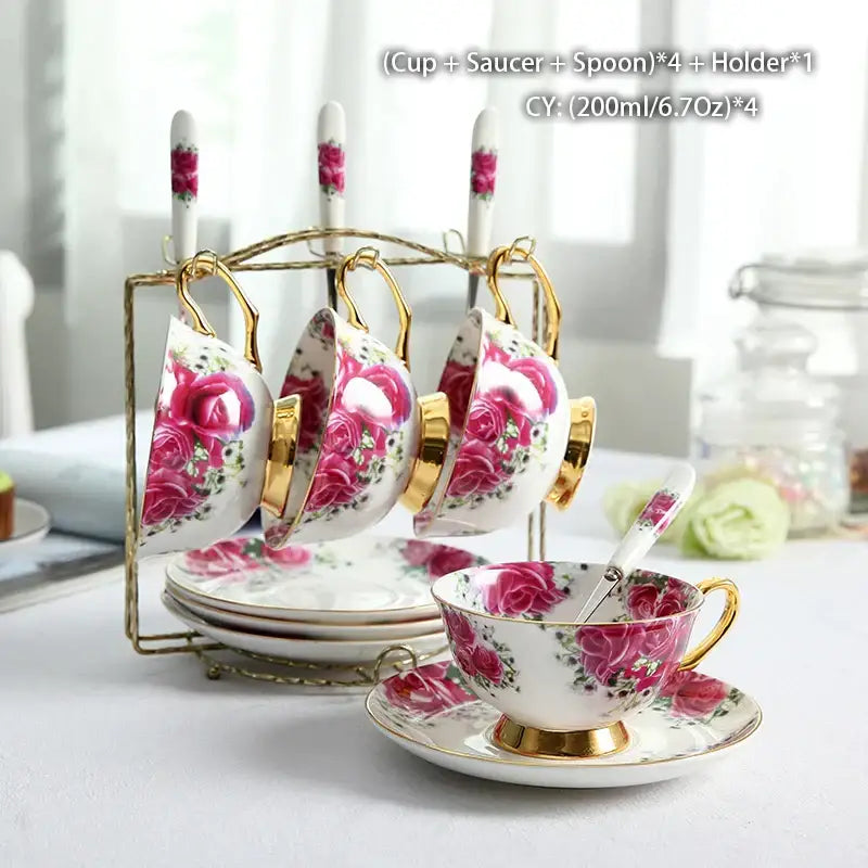 Set of four elegant white bone china tea cups with pink rose floral patterns and gold-trimmed rims by decorbites bone china