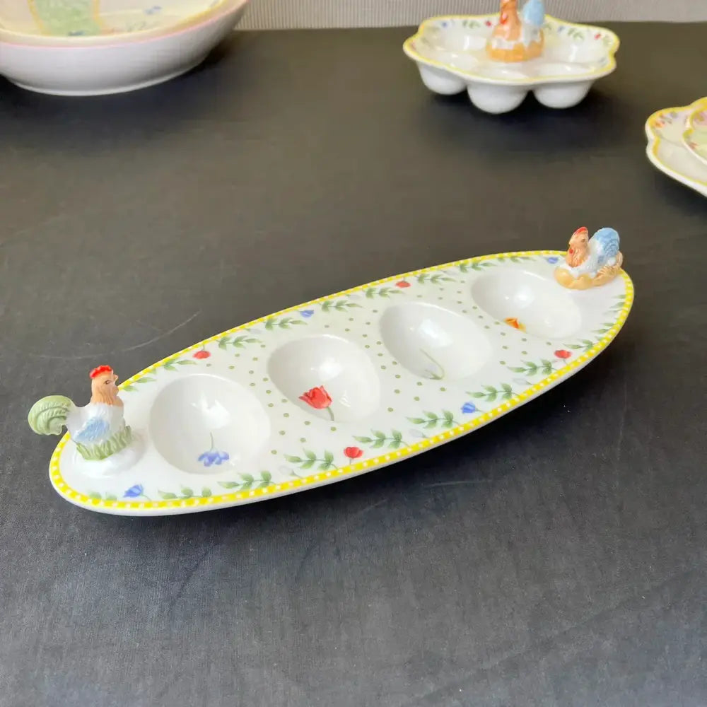 Floral scalloped white porcelain tulip dinnerware set featuring a white ceramic egg tray with yellow trim and rooster accents
