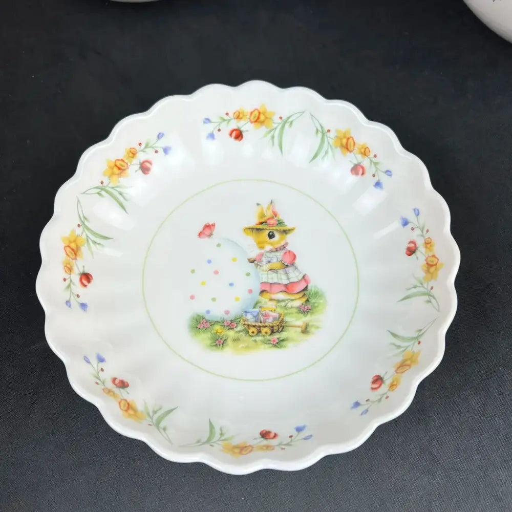 White ceramic easter tulip dinnerware set plate with bunny in yellow hat pink dress and floral borders