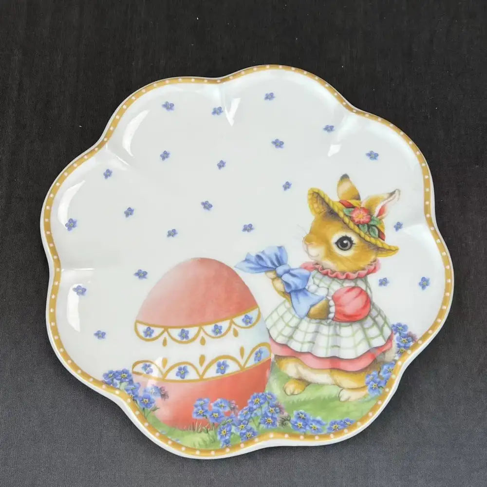 White ceramic scalloped plate from floral scalloped white porcelain tulip dinnerware set with easter bunny design