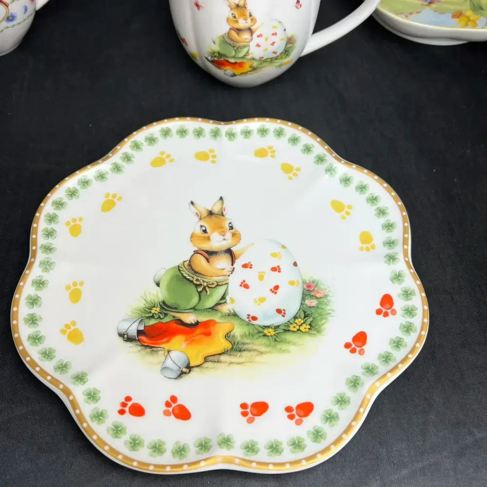 White ceramic scalloped plate with brown bunny and colorful prints in floral scalloped white porcelain tulip dinnerware set