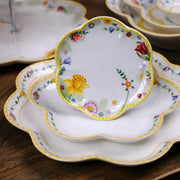Delicate white porcelain dinnerware set with scalloped edge and vibrant floral patterns for easter tulip dinnerware