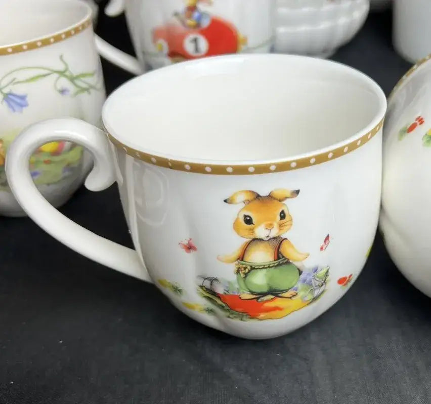 White ceramic mug with brown rabbit illustration and gold polka dots from floral scalloped easter tulip dinnerware set