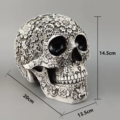 Floral silver carved skull figurine decorbites 20cm carved with intricate floral patterns and black eye sockets for Halloween decor