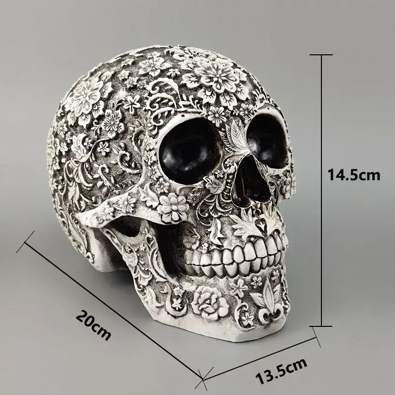 Floral silver carved skull figurine decorbites 20cm carved with intricate floral patterns and black eye sockets for Halloween decor