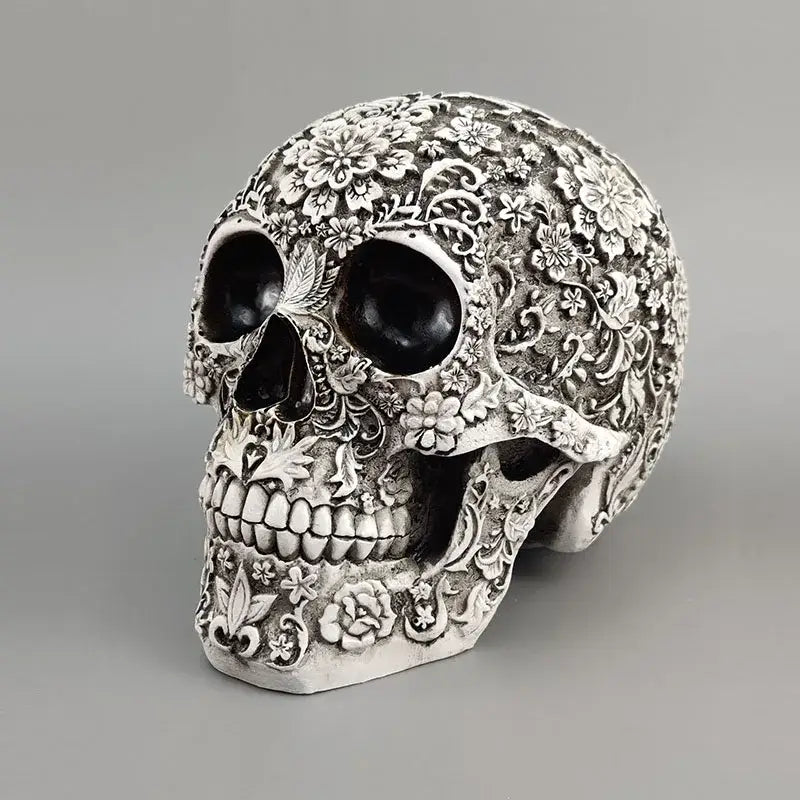 Floral silver carved 20cm skull figurine with intricate vine patterns and blackened eye sockets for halloween decor