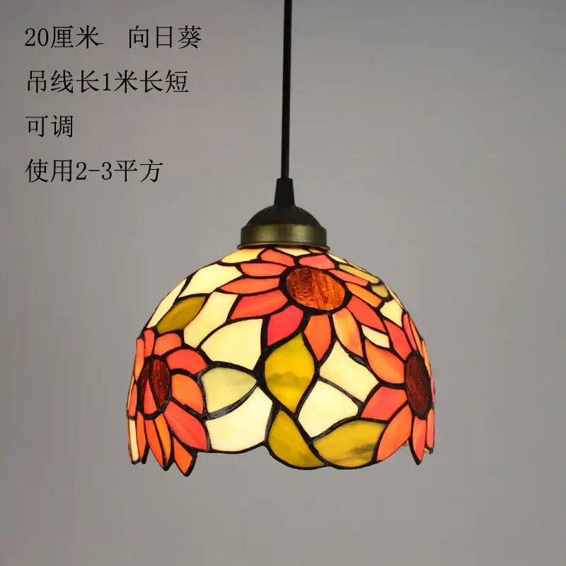 Floral stained glass baroque tiffany pendant light featuring a vibrant sunflower design in orange and yellow hues for dining room decorbites baroque tiffany pendant