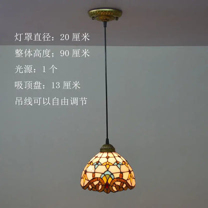 A warm-toned floral stained glass pendant light in amber yellow and teal hues decorbites baroque tiffany design