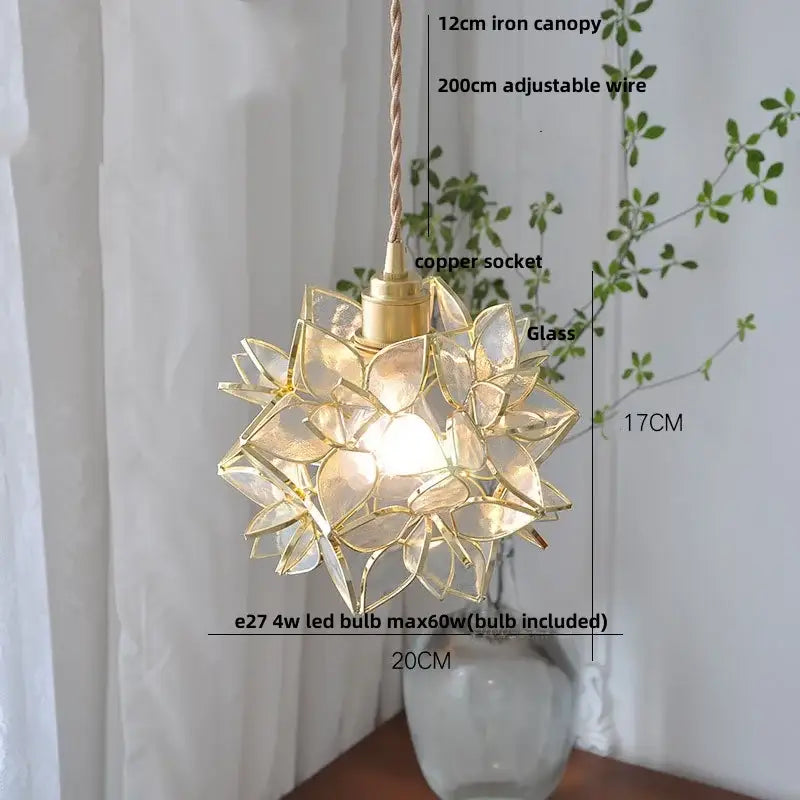 A delicate gold-toned floral stained glass copper led pendant lamp with a starburst design for dining room lighting