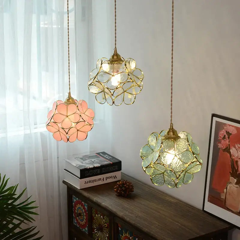 Three floral stained glass copper led pendant lamps with gold frames and pink clear green petals for dining room lighting
