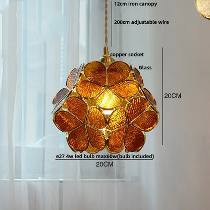 A warm amber glass copper led pendant lamp with gold frame and adjustable copper socket for dining room lighting