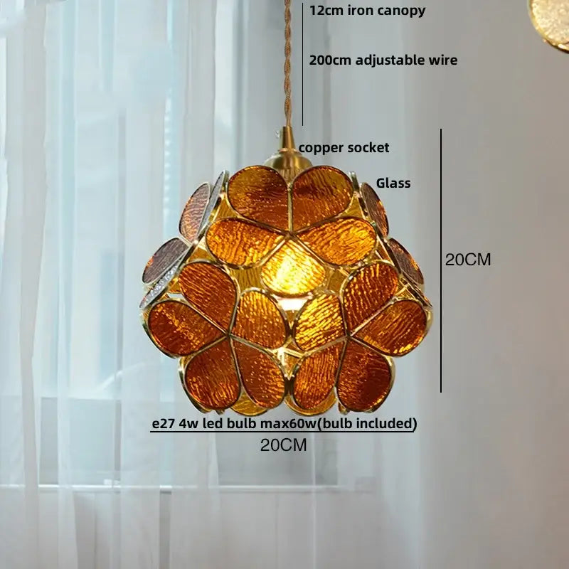 A warm amber glass copper led pendant lamp with gold frame and adjustable copper socket for dining room lighting