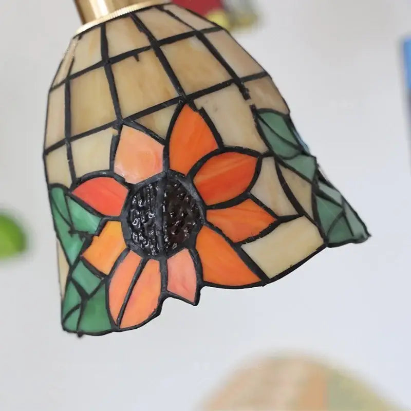 A vibrant orange and green floral stained glass pendant light with black leaded edges for colorful glass led decorbites