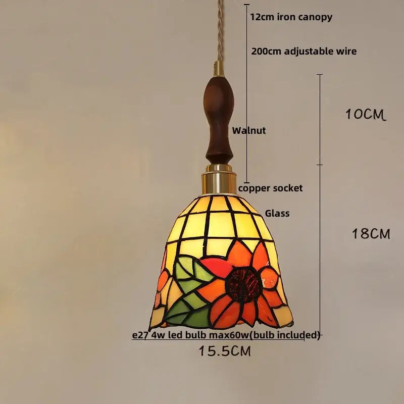 A vibrant floral stained glass pendant light with sunflower design in orange yellow and green hues for dining decorbites colorful glass led