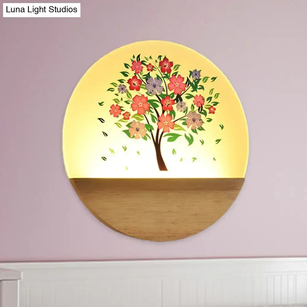 Floral tree acrylic shade wall light with a warm yellow glow and animal flowering design on wooden base for bedroom use