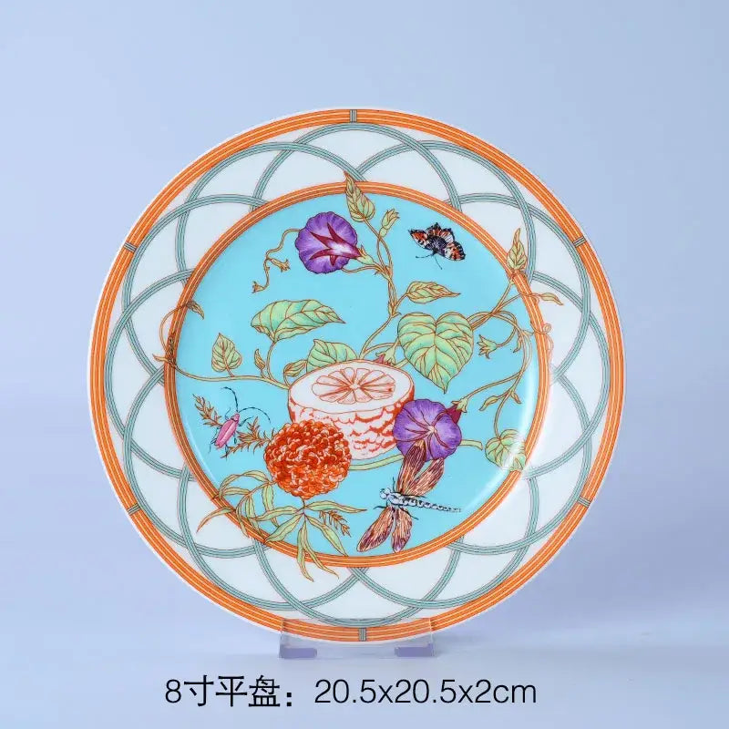 Decorative turquoise and gold bone dinnerware set plate with morning glory flowers citrus slices and butterflies design