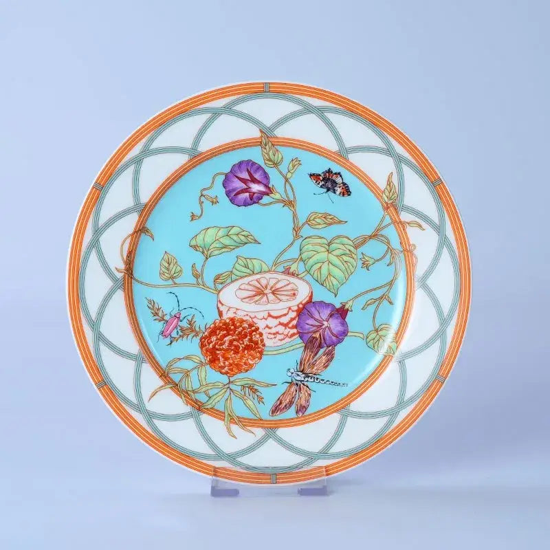 Decorative turquoise and gold bone dinnerware set plate with botanical morning glory flowers and geometric lattice border