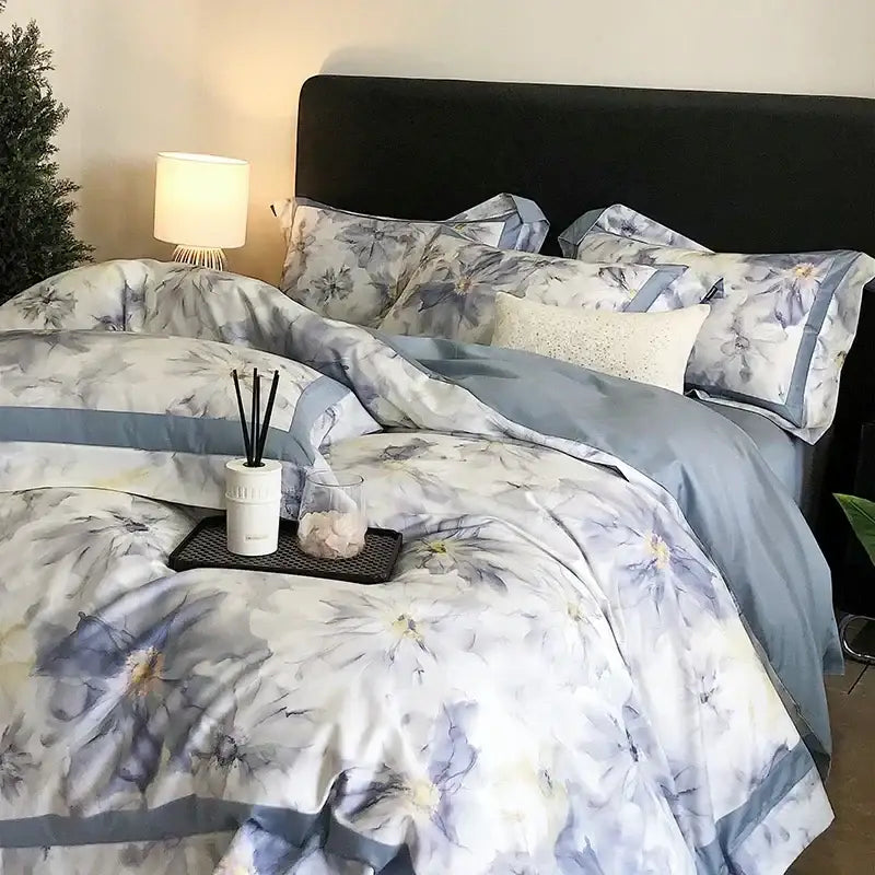 Soft light blue and white floral egyptian cotton bedding set with watercolor blossoms and matching pillowcases