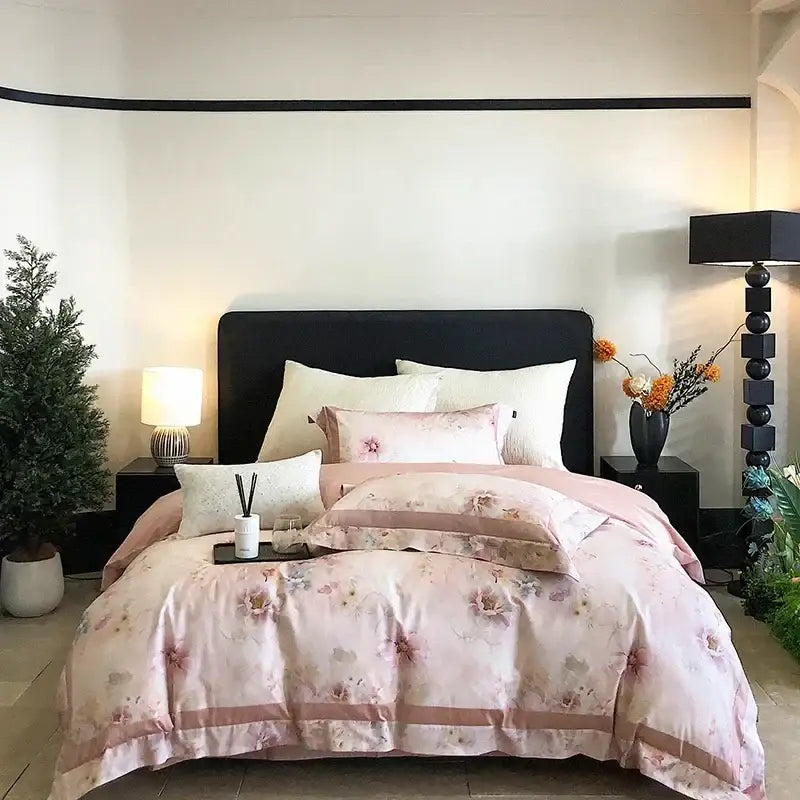 Pink floral satin duvet cover set with matching pillowcases and rose gold trim paired with egyptian cotton bedding set