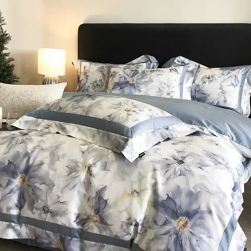 A soft floral watercolor bedding set in muted blues and whites with satin finish egyptian cotton bedding for bedroom