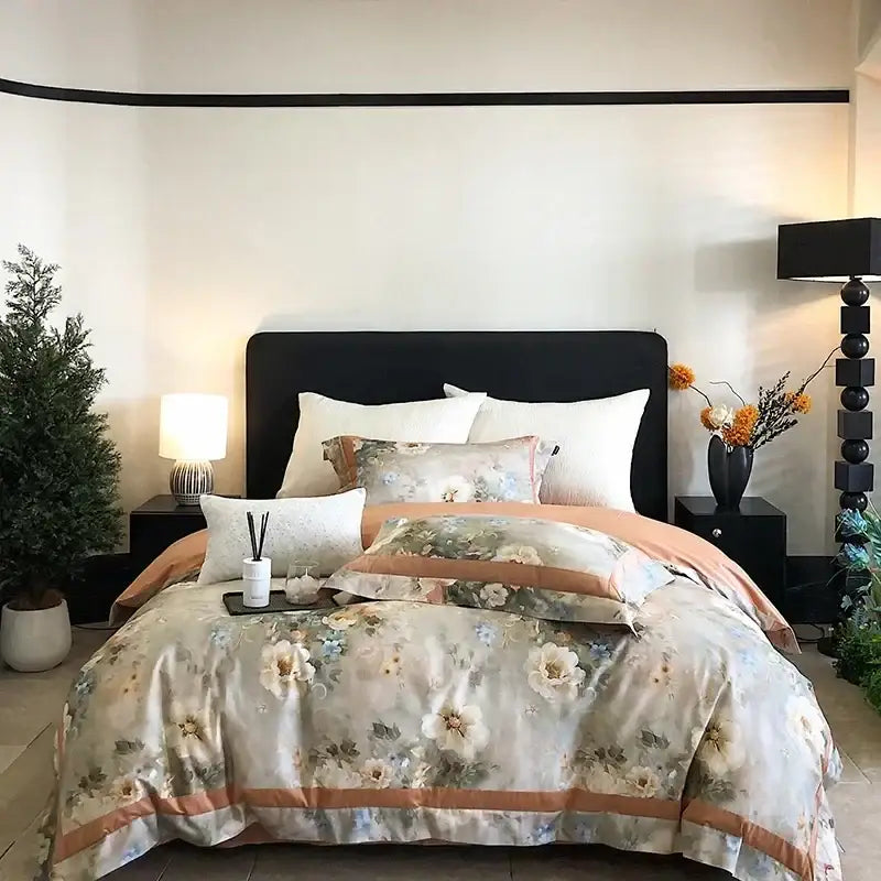 A soft floral patterned egyptian cotton bedding set in muted pastel tones with peach and cream accents