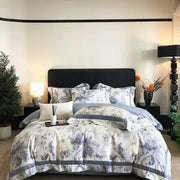 Elegant floral-patterned egyptian cotton bedding set in soft white and muted blue with gray accents for bedroom use