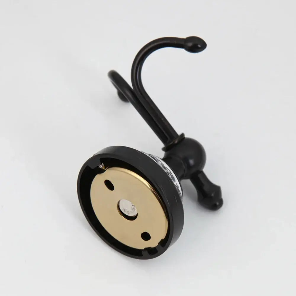 Floral white and black stainless steel bathroom towel hook with sleek curved black stainless steel decorbites design
