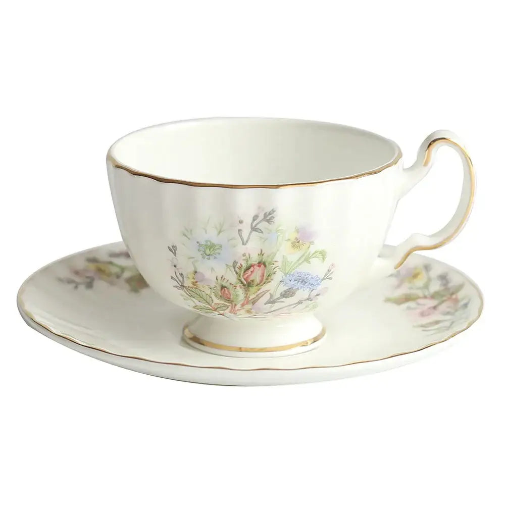 A delicate white bone tea set featuring a floral pattern with gold trim for an elegant tea-drinking experience