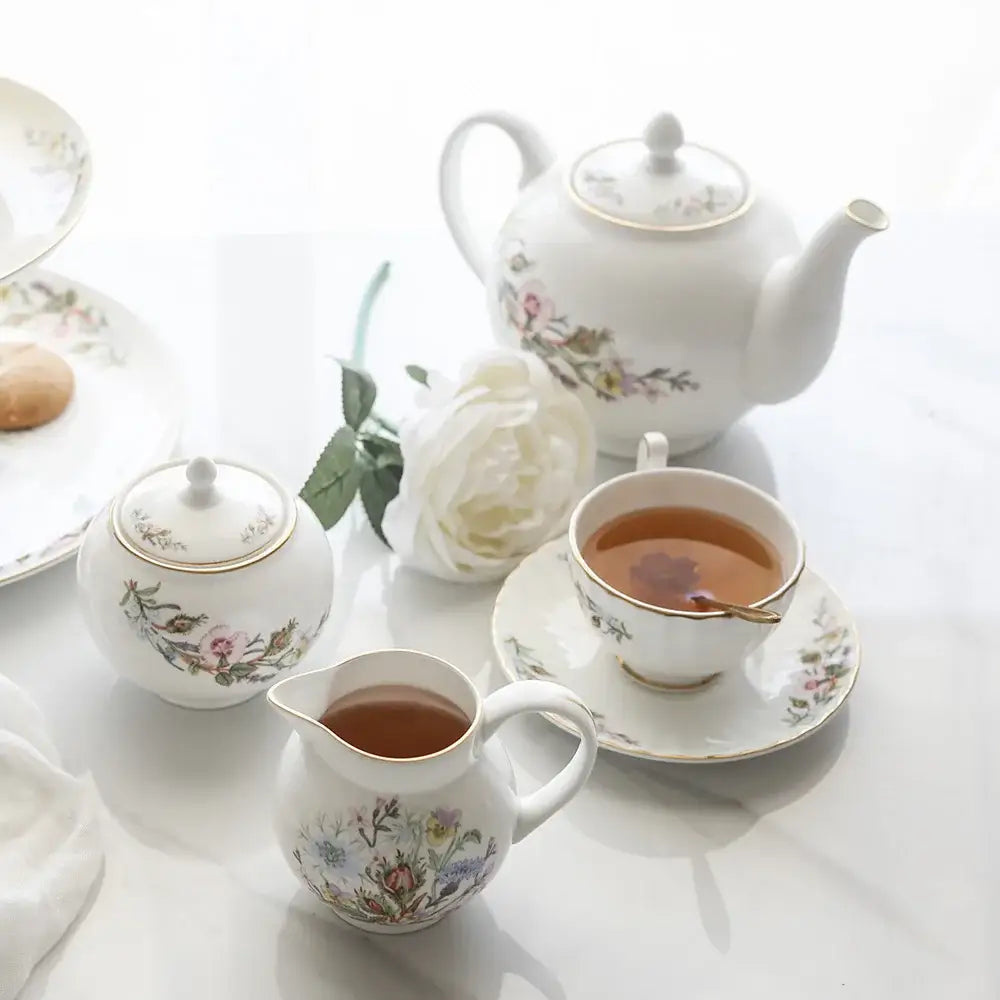 White bone tea set with delicate floral patterns and gold trim enhancing the tea-drinking experience
