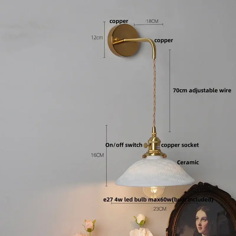 A vintage-style floral white ceramic brass led wall light with textured shade and adjustable 70cm wire for bedroom use