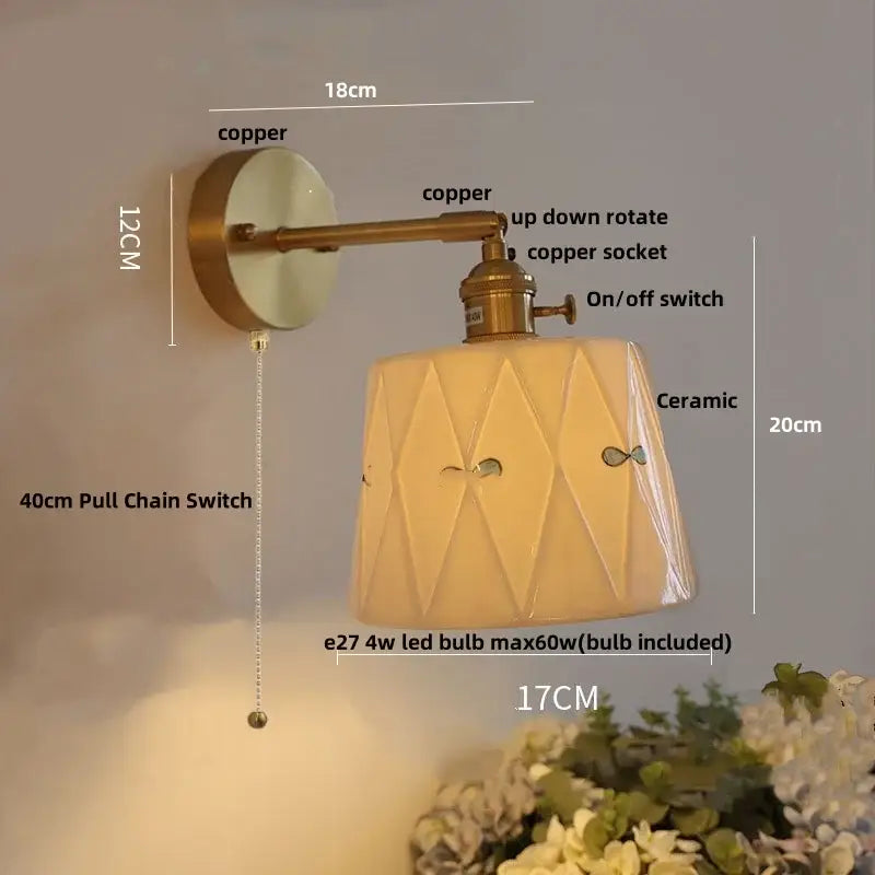 Copper-finished ceramic brass led wall light with geometric facets and decorative cutouts for bedroom use