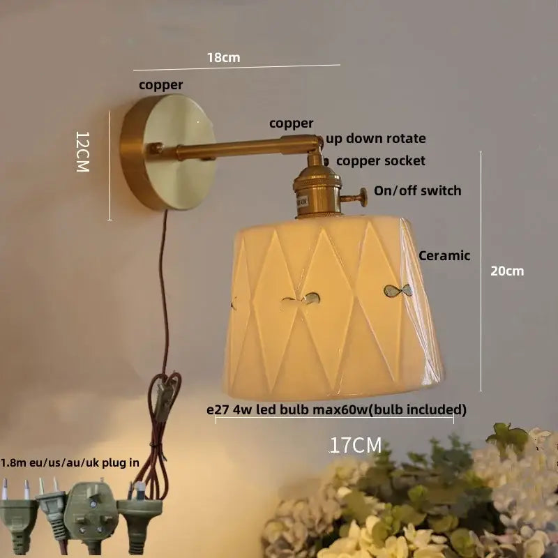 Copper-finished wall light with geometric floral white ceramic shade and brass led switch for bedroom use