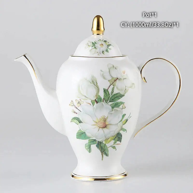 A white porcelain teapot with hand-painted magnolia blossoms and gold trim from decorbites camellia bone china set