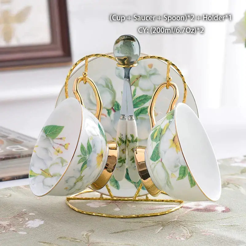 Elegant white porcelain teacups with green yellow floral patterns and gold accents on a decorbites camellia bone china stand