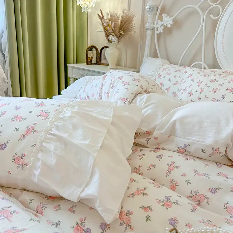 Floral white cotton bedding set with pleat lace ruffles featuring soft pink and purple roses on cream background