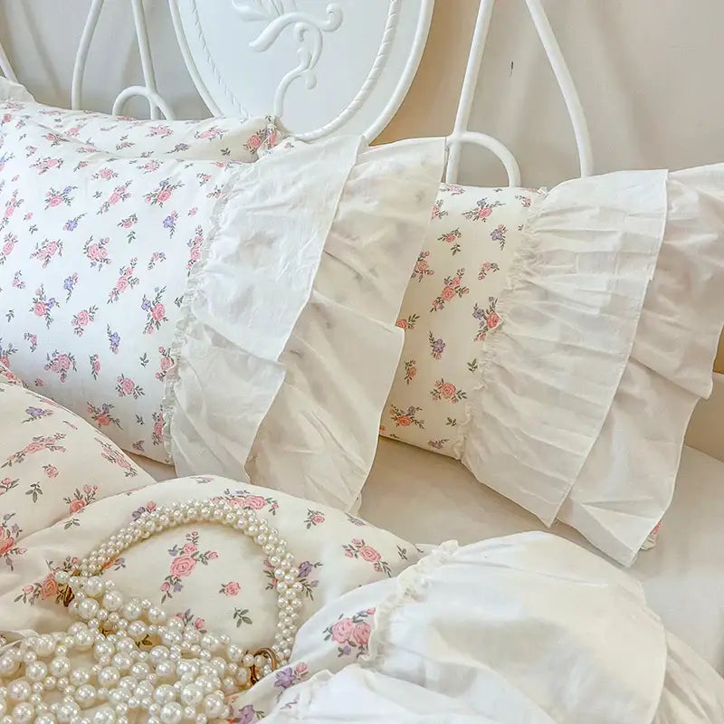 Floral white cotton bedding set with pleat lace ruffles featuring pastel floral pillowcases with delicate ruffled edges