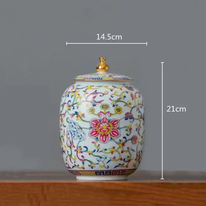 White enamelled porcelain tea caddy ginger jar with gold lid and colorful floral patterns for dining room use